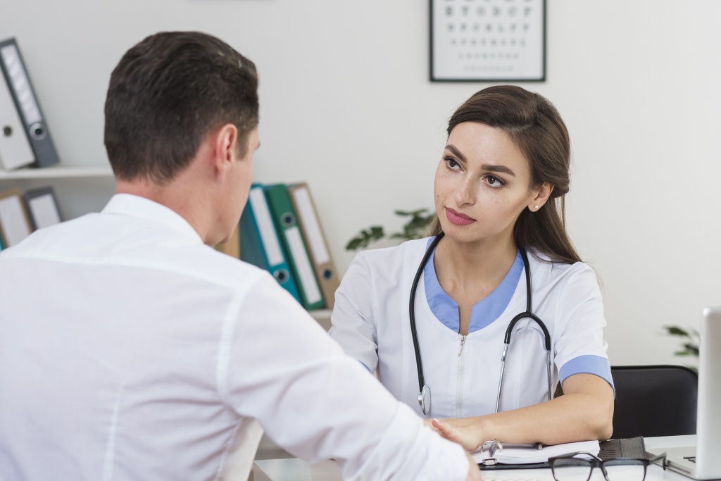 male-patient-talking-with-beautiful-doctor.jpg